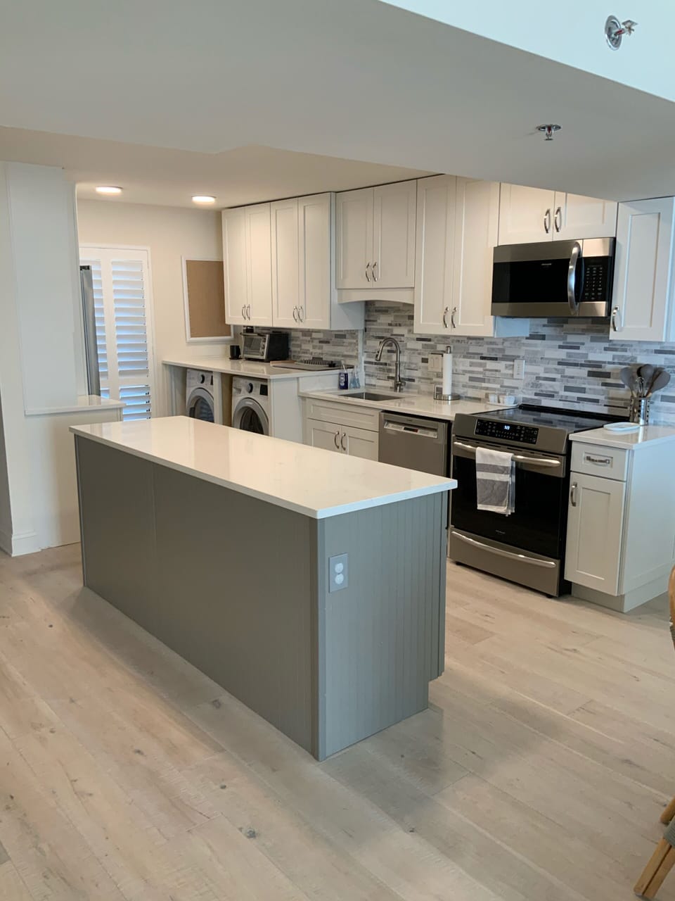 Kitchen with induction range & washer/dryer