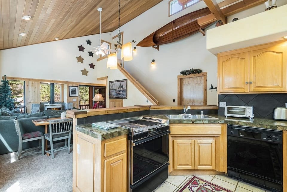 Open kitchen area with a breakfast bar and lots of natural light.