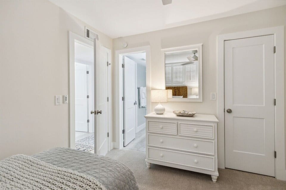 Twin Guest Room with Dresser and Access to Shared Hallway Bathroom