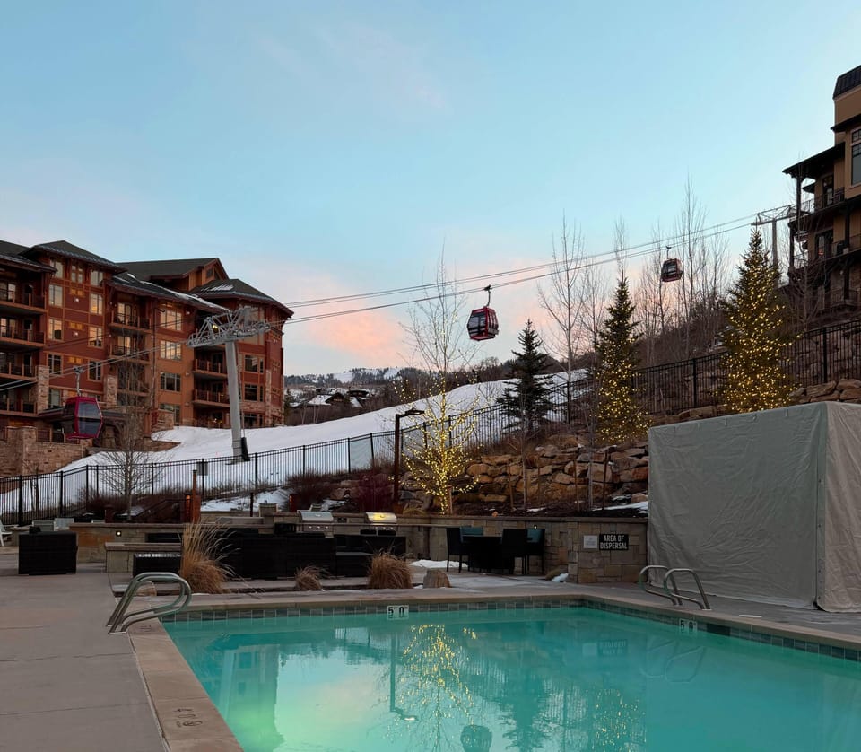 The Lift Condominiums pool with the Sunrise Gondola behind it.