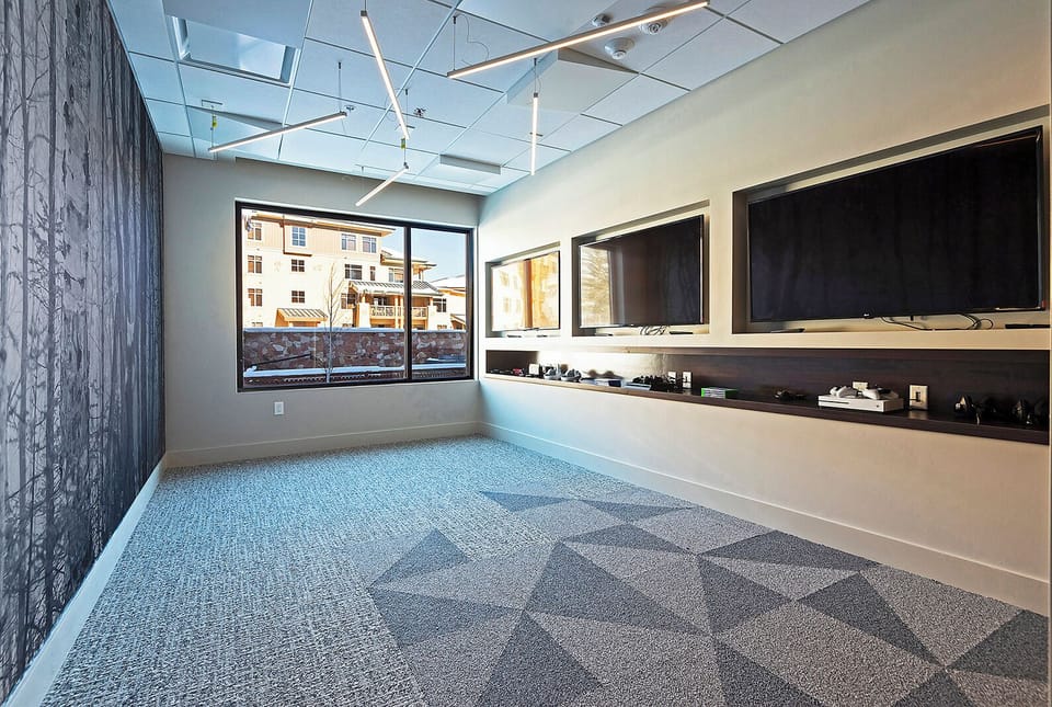 Lift teen lounge with 3 flat screen TVs and gaming consuls