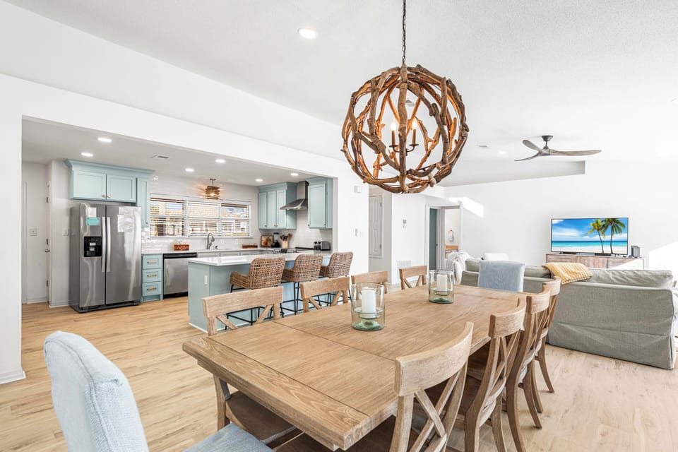 This Dining Table can Handle the Entire Group Seating 10!! Plus 3 More on the Kitchen Bar and a Pool View!!