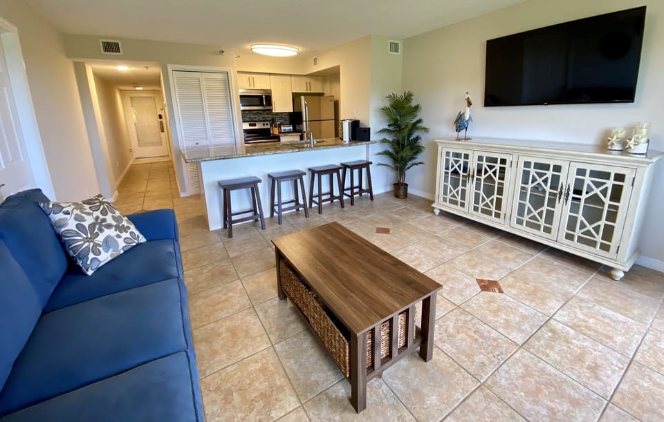 Living Room - Kitchen View. Sofa is a sleeper sofa