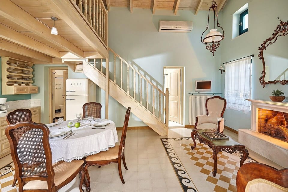 Living area. The renovated natural stone villas of 55 sqm in size plus 11 sqm wooden loft with a double bed