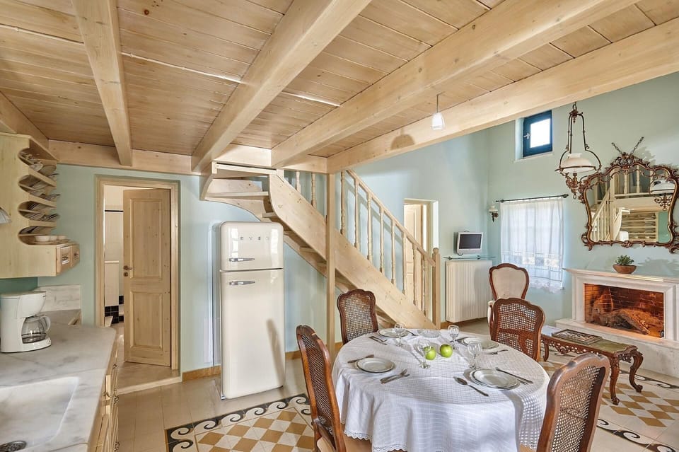 Living area. The renovated natural stone villas of 55 sqm in size plus 11 sqm wooden loft with a double bed