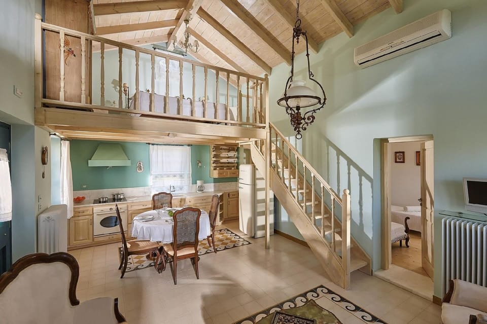 Living area. The renovated natural stone villas of 55sqm in size plus 11 sqm wooden loft with a double bed