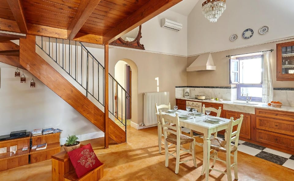 Living area. The renovated natural stone villas of 55 sqm in size plus 11 sqm wooden loft with a double bed