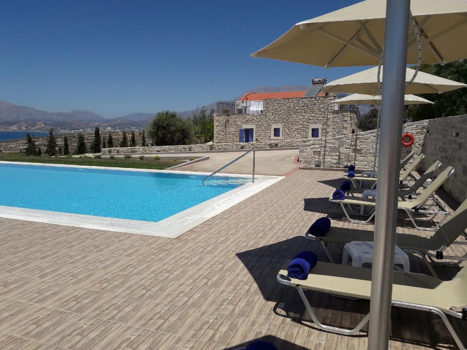 Pool. The 82sqm swimming pool with free umbrellas and sun beds