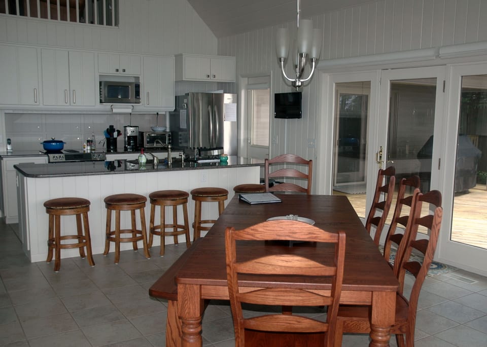 kitchen and dining area with table and counter seating