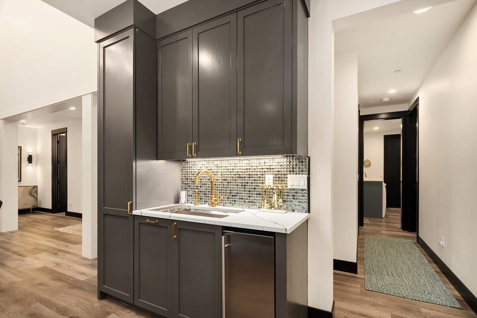 Fully stocked bar off the dining room in between kitchen and great room.