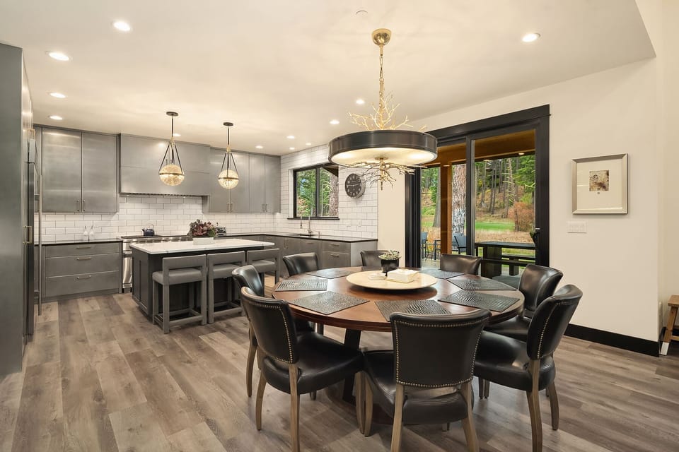 Main floor dining and kitchen with easy access to patio thru 2 sets of sliders.
