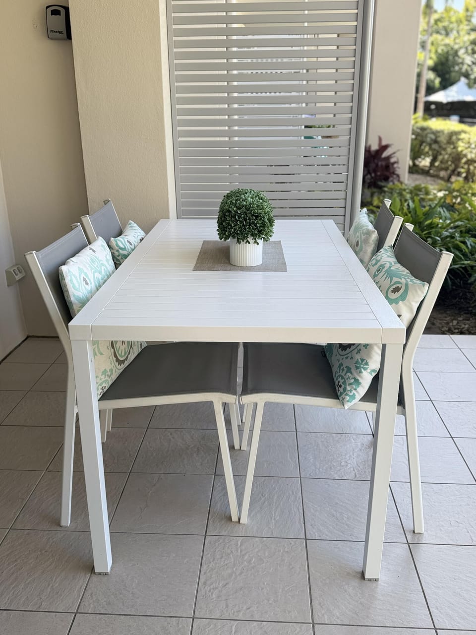 4-seater outdoor dining table with cushions
