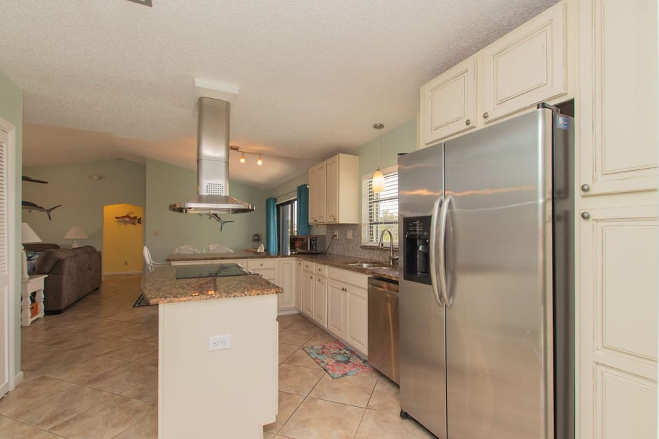 Walk up the steps & arrive in a fully renovated kitchen!