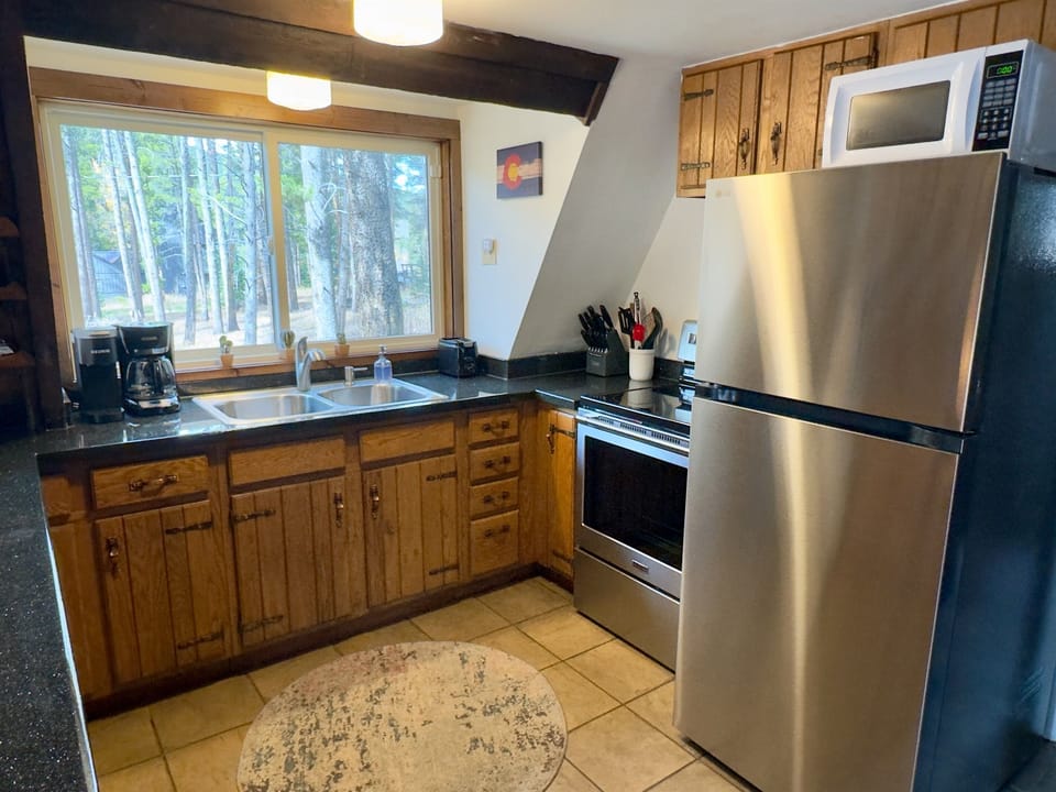 Fully stocked kitchen is ready for you to prepare and serve your favorite meals