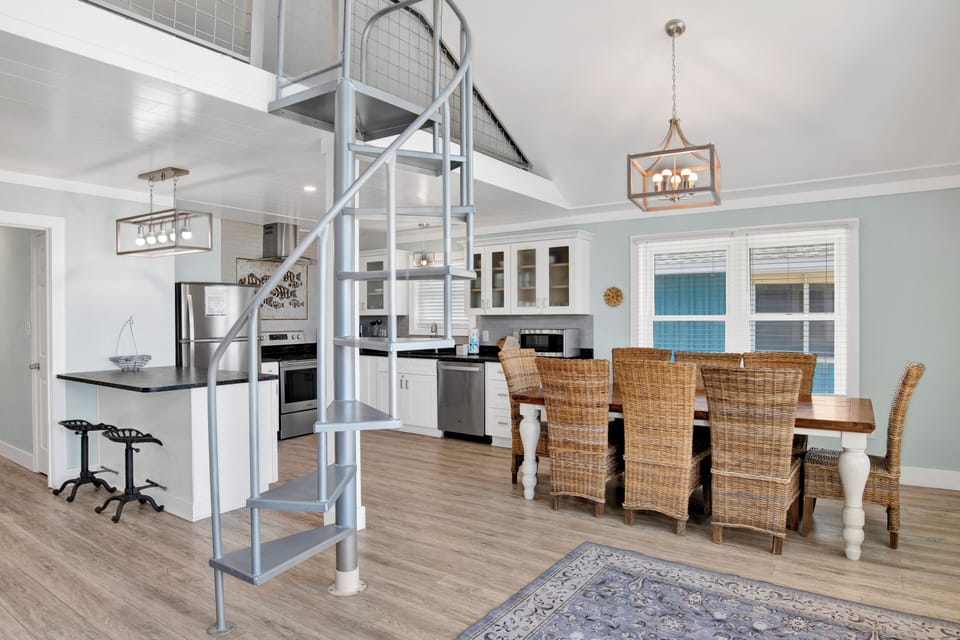 Open living concept and spiral staircase for the loft area