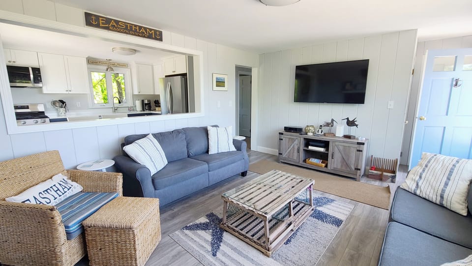 Living room with comfortable seating and flat screen TV