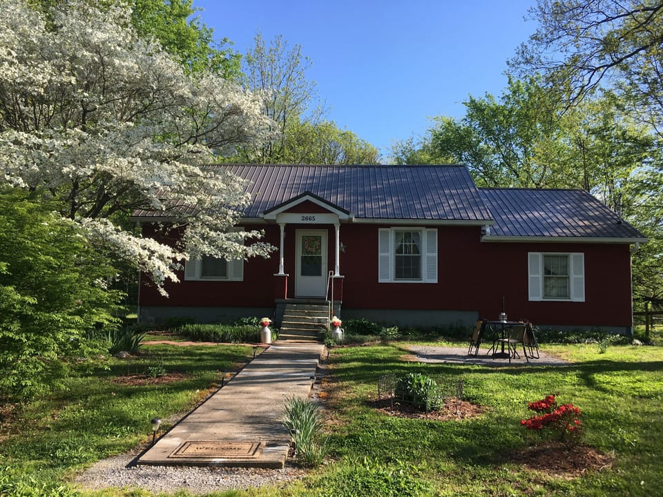 Front entrance in spring. A new metal roof was installed in October of 2018.