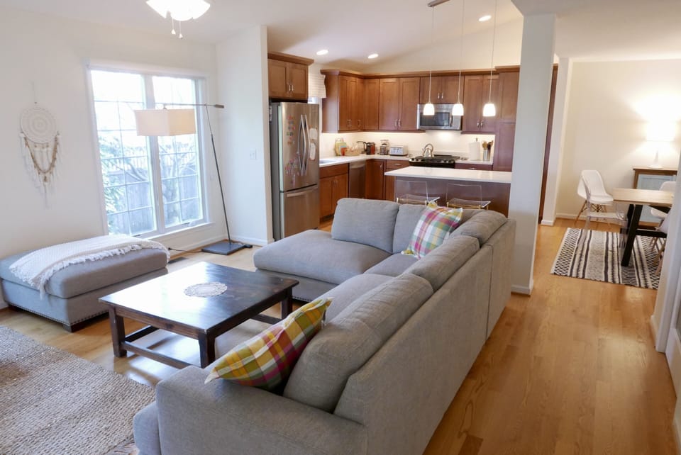 Living space off the kitchen with lots of sun and access to the screened porch