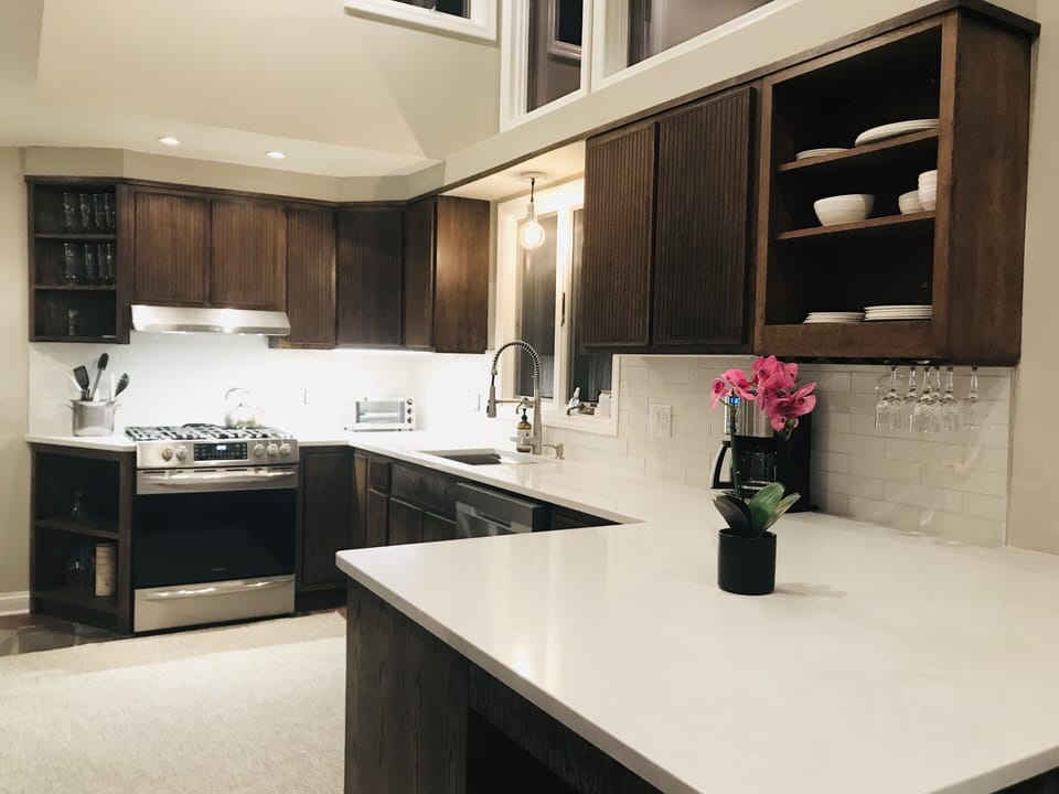 Newly renovated kitchen, 5 burner gas stove top, expansive quartz countertops
