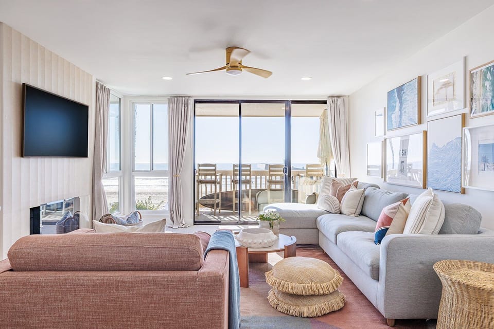 A thoughtfully furnished living area featuring elegant modern beach décor