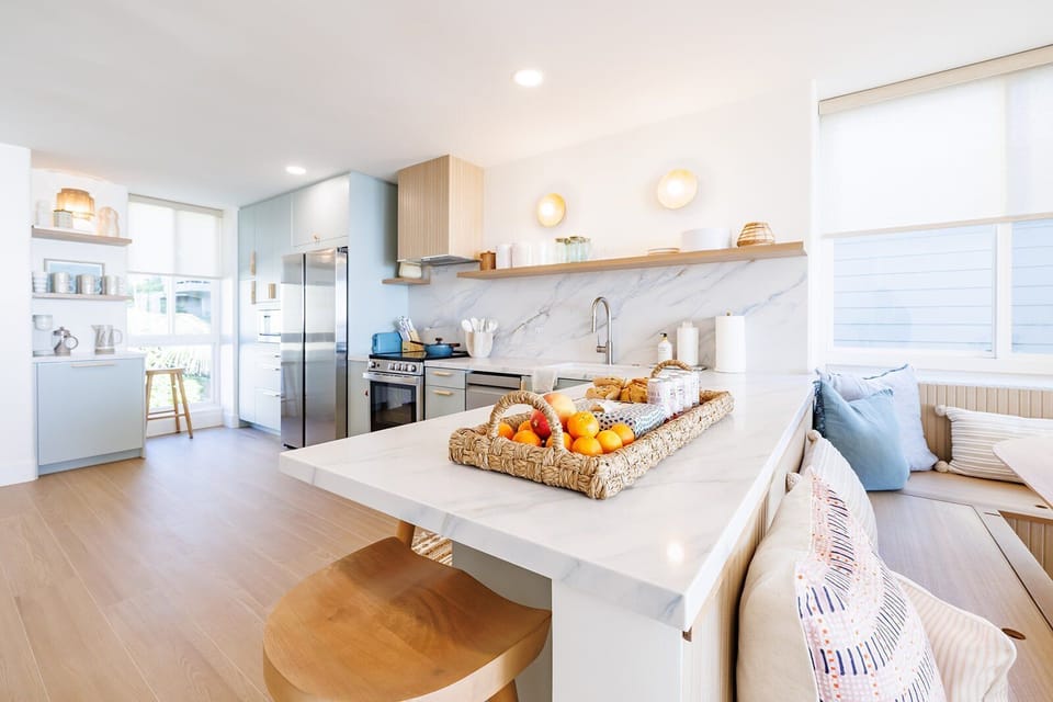 This stunning unit features abundant lighting throughout