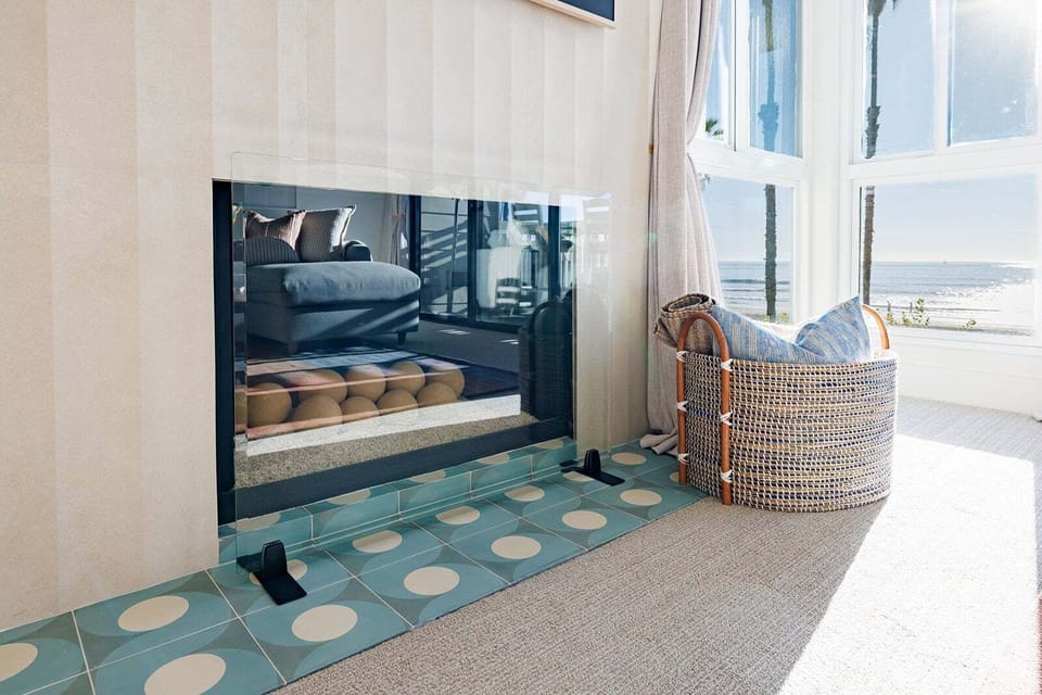 The renovated custom fireplace adds warmth and charm for chilly evenings.