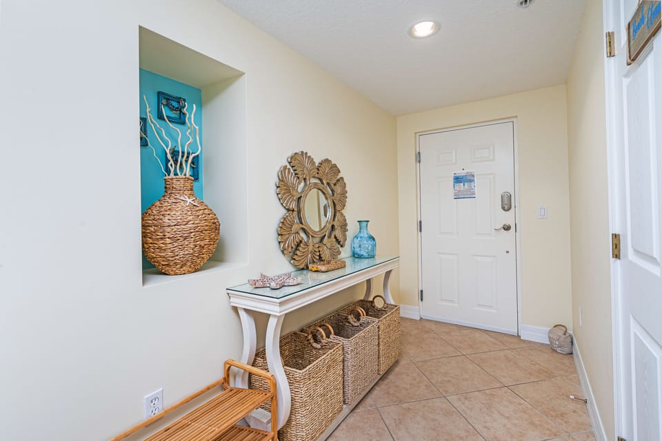 Unit foyer next to the unit door.  Perfect for kicking off sandy shoes!