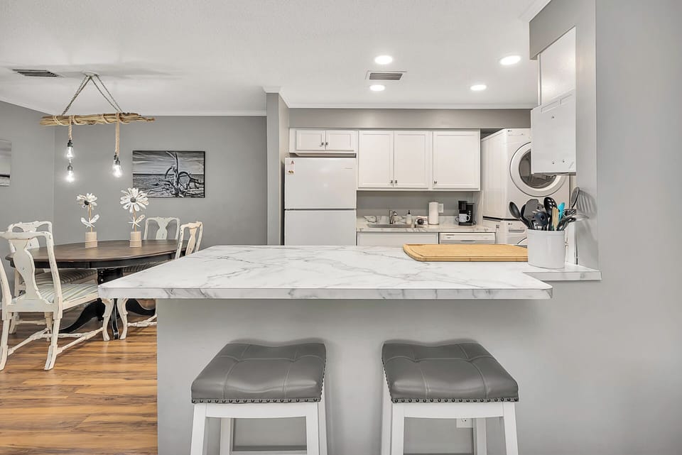 Looking over breakfast bar into kitchen