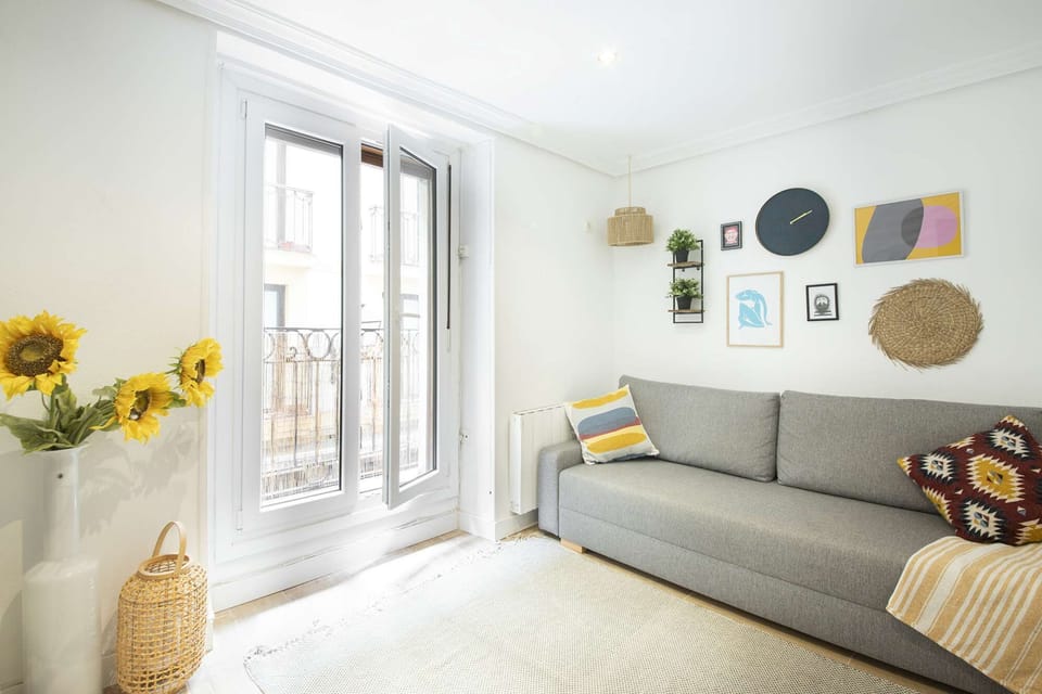 Lounge with double sofa, TV and balcony