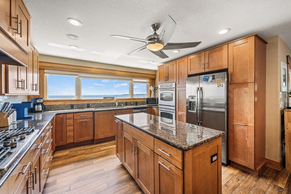 Gourmet Kitchen Area with Bar Seating and Views of the Sound