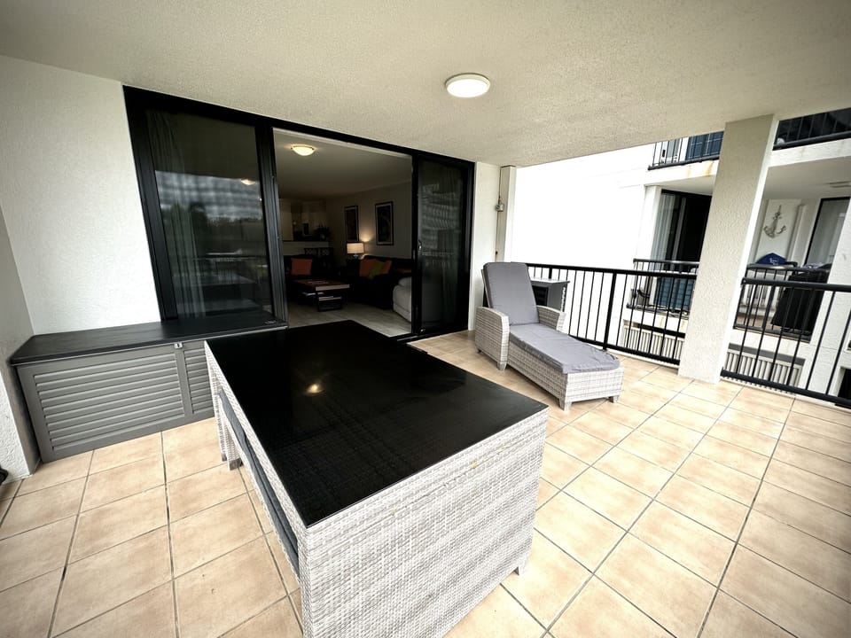 Balcony with Dining table and sunlounge