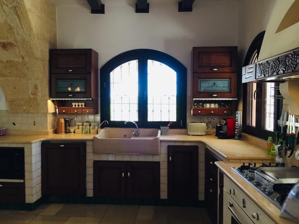 The kitchen has a large oven and grill, microwave, fridge freezer and dishwasher