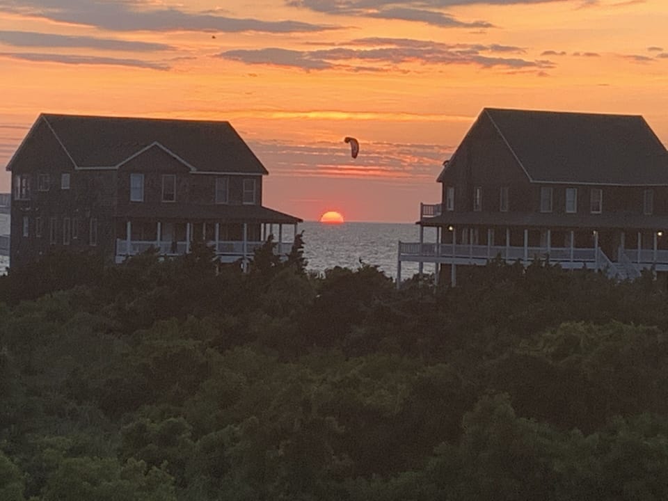 Kiteboarders over the sound at sunset!!