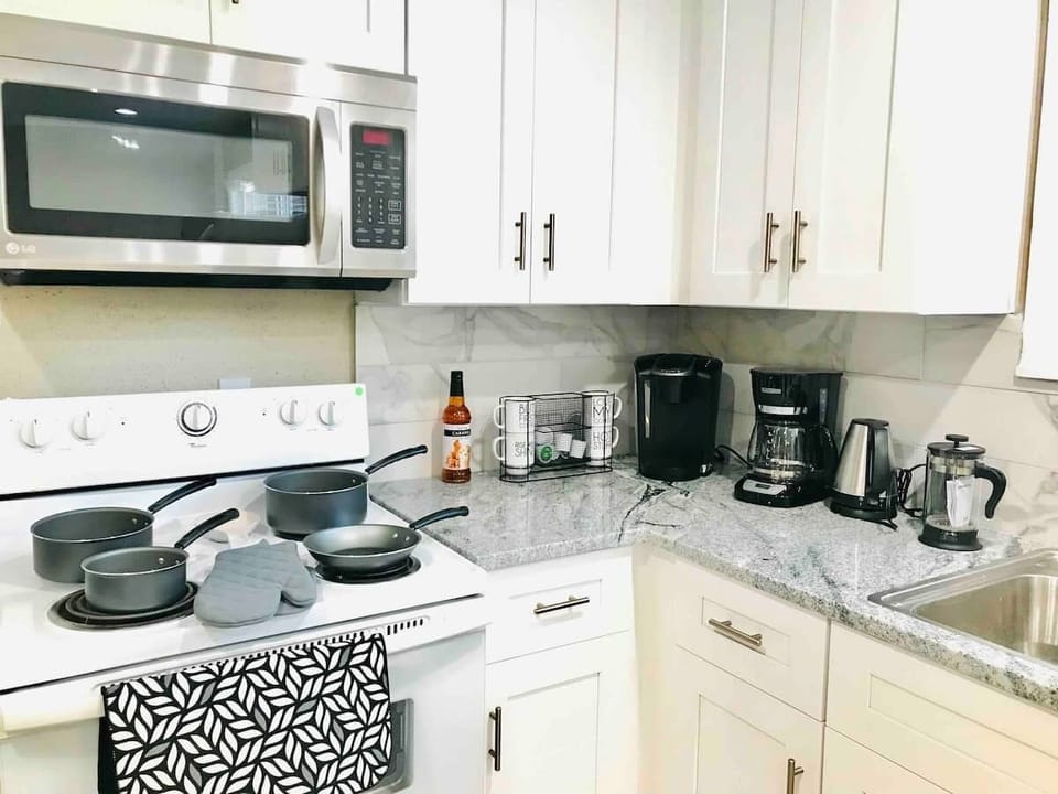 Kitchen / Coffee Station 
- Stove 
- Microwave
- Water warmer