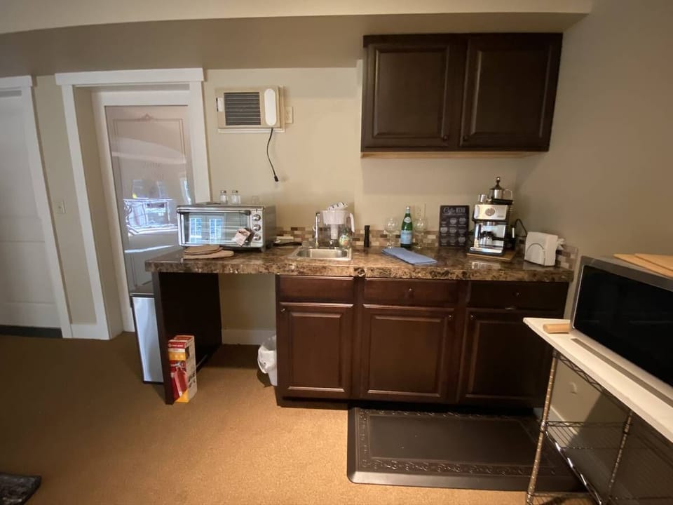 Microwave, toaster oven, Keurig coffee maker with all the fixing you need. 