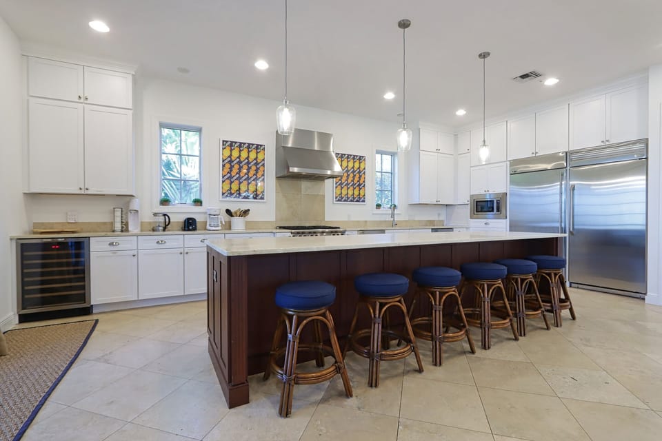 Kitchen with stainless steel appliances and breakfast bar