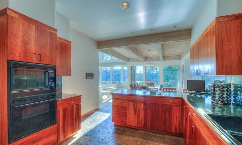 Gourmet kitchen with a new Frigidaire wall oven and microwave, dishwasher, electric cooktop. Great selection of cooking basics and small appliances.