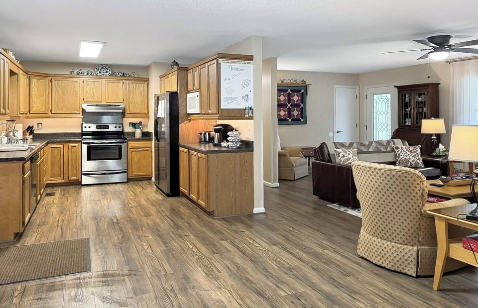The living room is continuous with the dining room and kitchen area, creating an open concept.