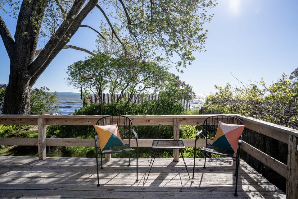 Listen to the waves & soak in the drops of morning sun from the deck.