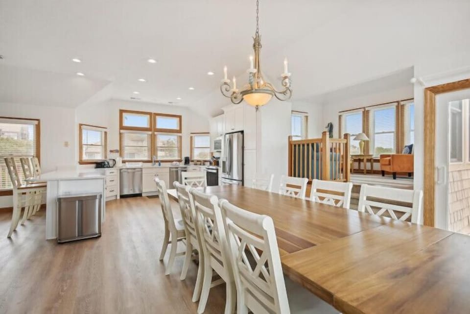 Picture yourself here—bright, open spaces where natural light pours through elegant wood-framed windows, warming the gleaming hardwood floors beneath your feet as you gather with loved ones.