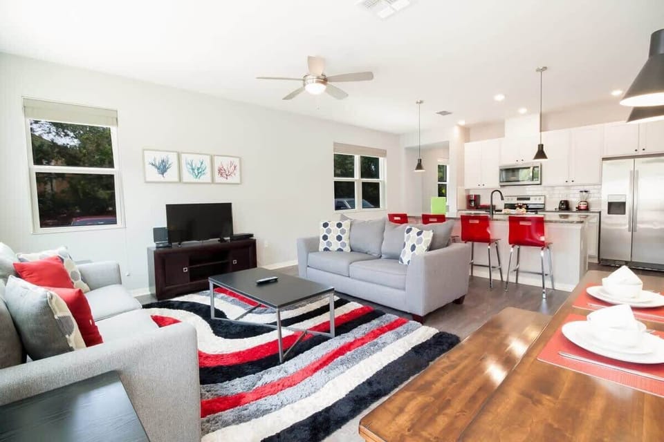 Bright open-plan living area with modern furnishings. Great for family time.