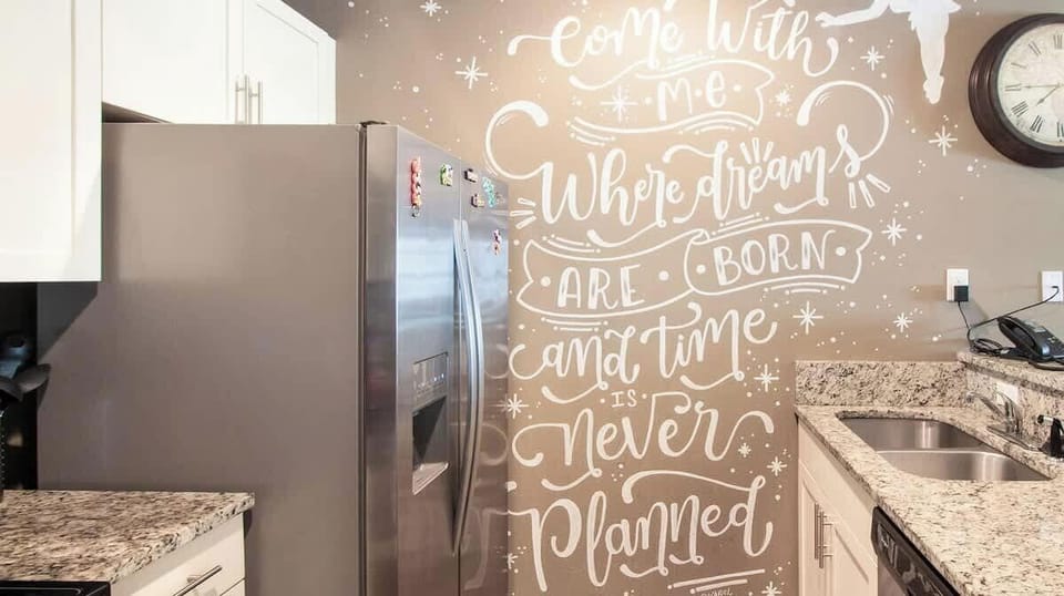 Fully equipped kitchen with a full-size double-door fridge and freezer.