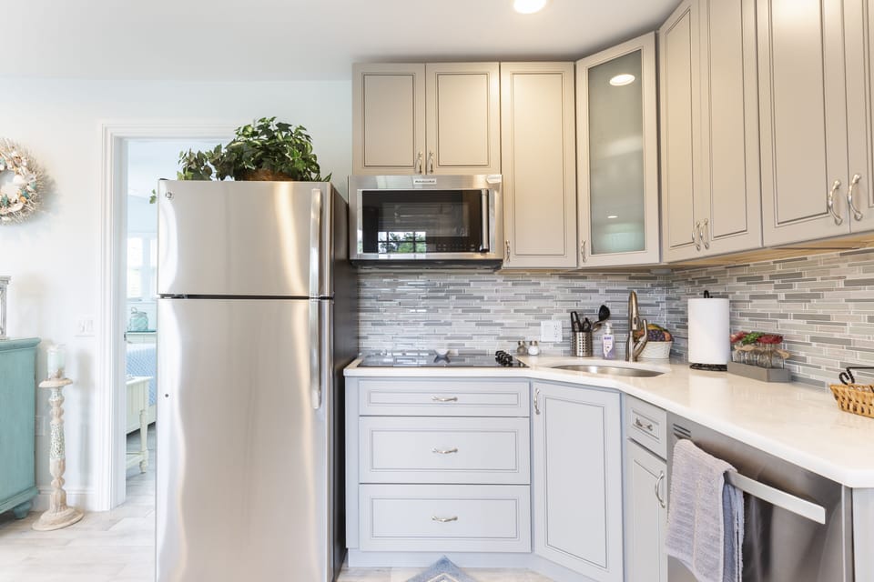 Kitchen- Stainless steel appliances.  4 burner cooktop, convection microwave...