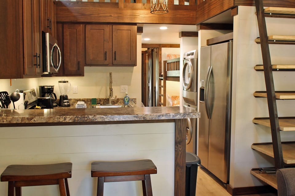 Kitchen With Stairs To Loft