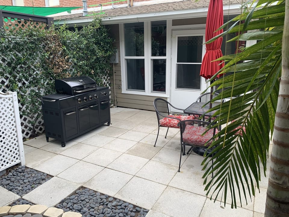 Private fenced backyard off of air-conditioned patio with gas barbecue