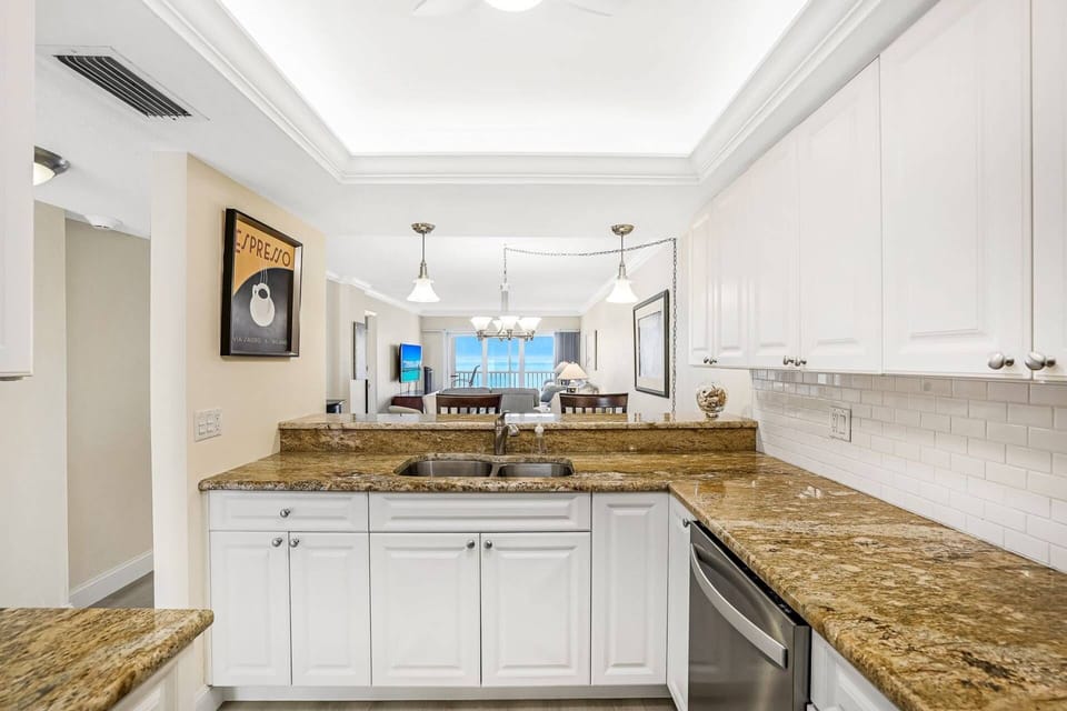 The pass thru kitchen allows the cook to enjoy the view and the counter provides bar stool seating for 2.