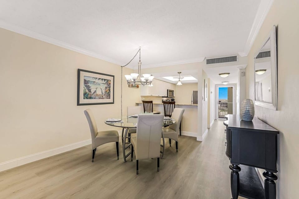 An eating bar with 2 bar stools separates the kitchen from the dining area.