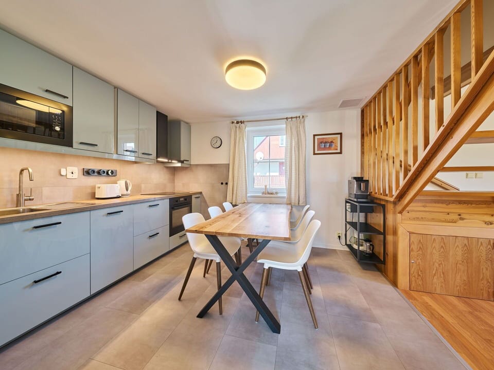 Furniture, Interior Design, Flooring, Countertop, Wood, Kitchen, Cabinetry, Ceiling, Floor, Kitchen & Dining Room Table