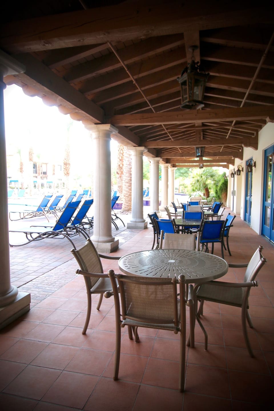 Poolside tables in clubhouse area. 
