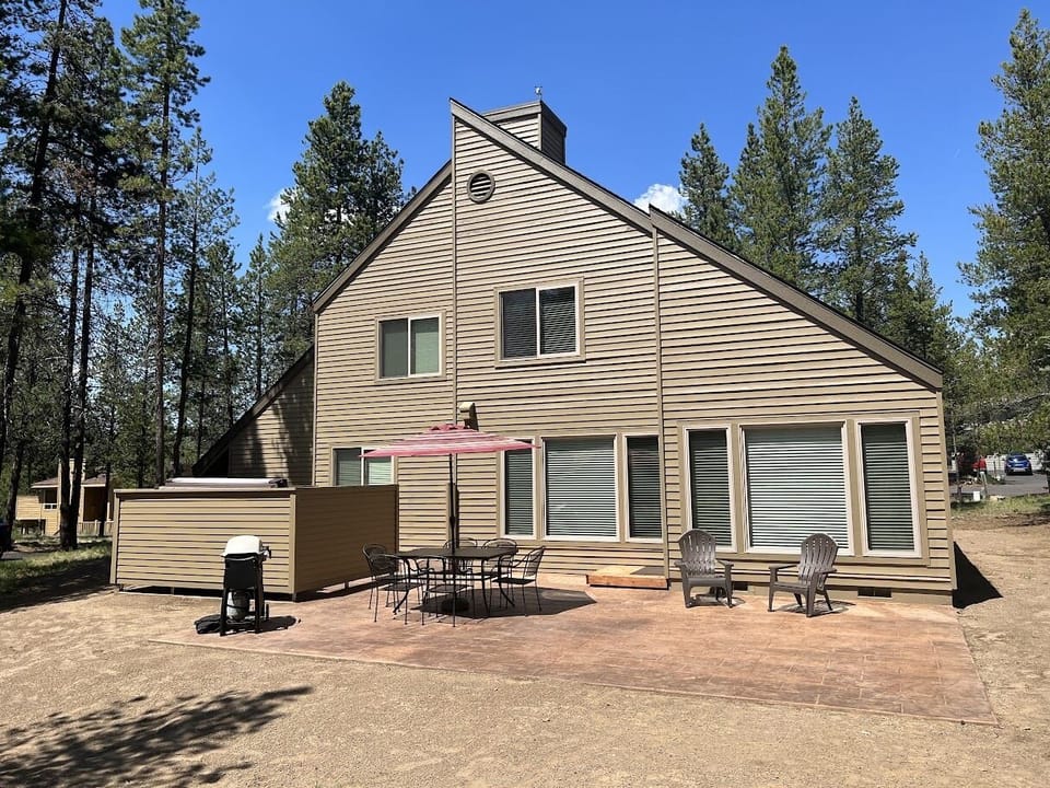 Large private patio area with Weber gas grill and outdoor table.